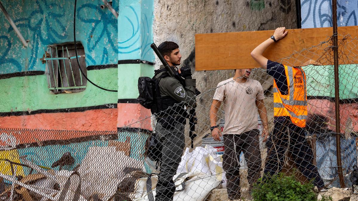 Eight Israelis held after assault on Palestinian village